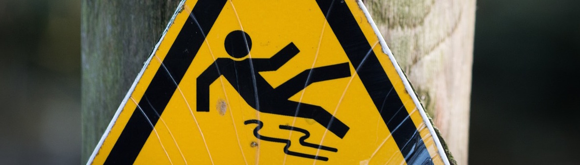 Sign of a man falling on a slippy floor.